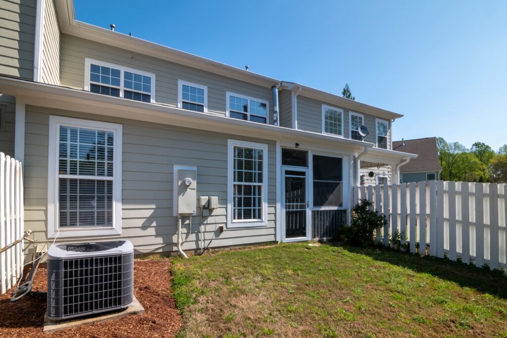 Light gray lap siding and white-trimmed windows on a Twin Cities home, the kind of siding replacement Lakeside Roofing & Remodeling handles.